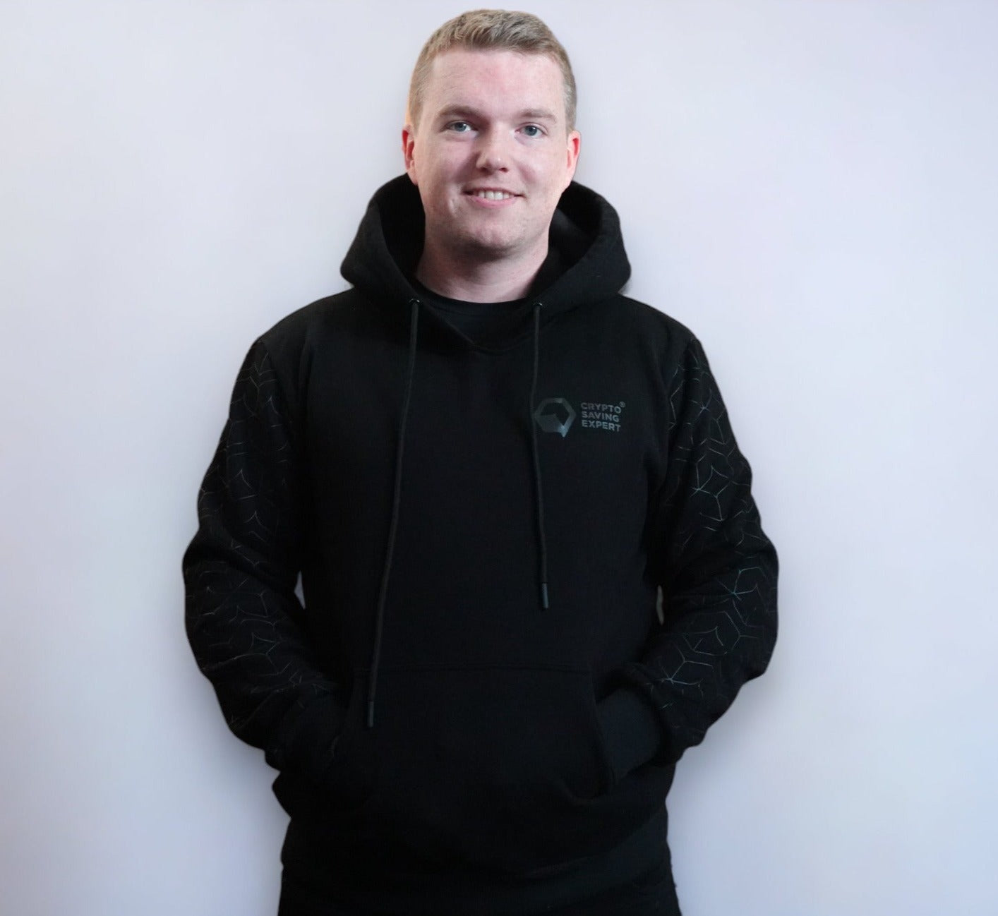 Cryptocurrency style hoodie, CSE Hoodie, blacked out stealth hoodie man front side angle |